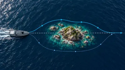 Autonomous surface vessel steering around a rocky island to avoid an obstacle